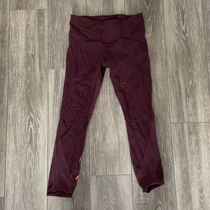 Maroon Lululemon Fast and free cropped leggings. Size 6. Cute mesh detail.